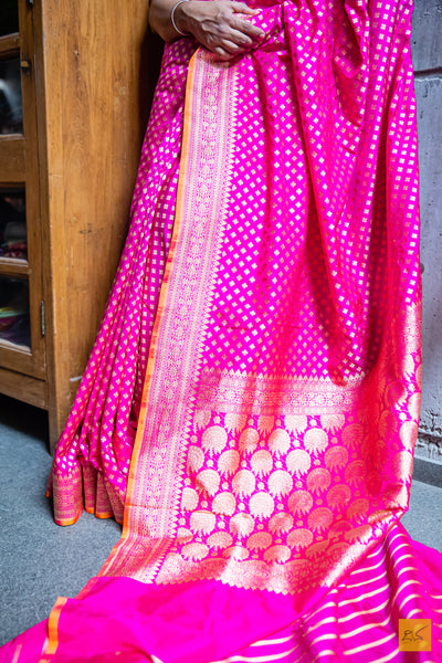Exquisitely handwoven in Banarasi silk, this rani pink saree is perfect for any formal occasion. Its small motifs woven in cutwork style adds a stylish, traditional charm, while its luxuriously soft and effortless drape provides comfort and elegance.