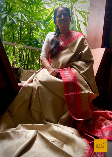 Saudamini is a beautiful, handwoven dupion silk sari with a temple border. The bold combination of the beige and red make this sari perfect for any occasion. Crafted with expert artisans, this sari is sure to turn heads.  Fabric-Raw (Dupion) Silk.