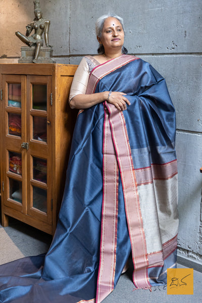 This stunning BLUE-MAGENTA MAHESHWARI SILK COTTON HANDWOVEN SAREE is a perfect combination of elegance and tradition. The high-quality fabric and handwoven craftsmanship make it suitable for both formal and casual occasions. With its vibrant colour and included blouse, this saree is sure to elevate your wardrobe.
