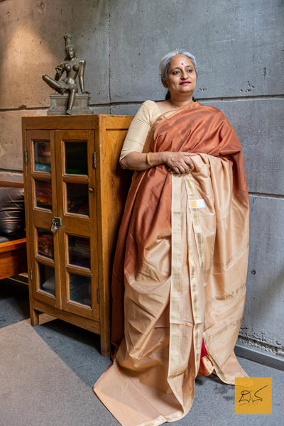 Elevate your style with our Beige-Brown Ombre Maheshwari Silk Cotton saree. This gorgeous saree boasts a stunning color fade, crafted from the finest Silk Cotton blend.