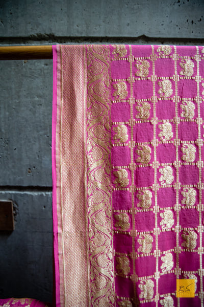 A soothing pink banarasi saree in georgette. perfect for a wedding and festivities too. what say? Presenting a georgette banarasi saree in chequered jaal pattern with woven elephant motifs.