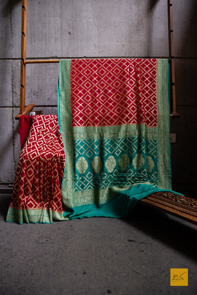 Invoke your inner beauty with this saree! Presenting this lovely red and green contrast georgette banarasi saree with zari jaal pattern. This saree is perfect for wedding receptions, house warming, mehendi, sangeeth and all other festivities.