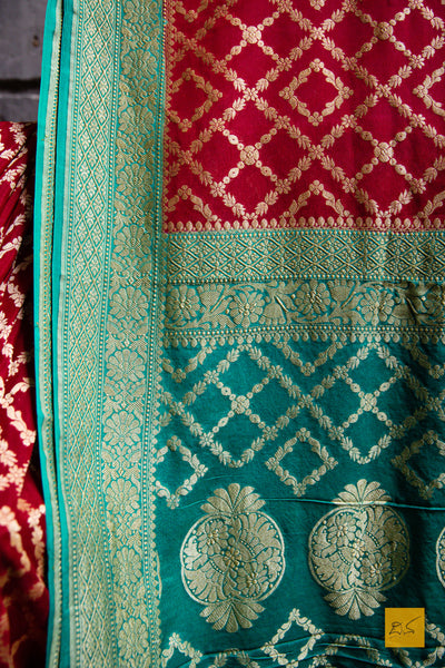 Invoke your inner beauty with this saree! Presenting this lovely red and green contrast georgette banarasi saree with zari jaal pattern. This saree is perfect for wedding receptions, house warming, mehendi, sangeeth and all other festivities.