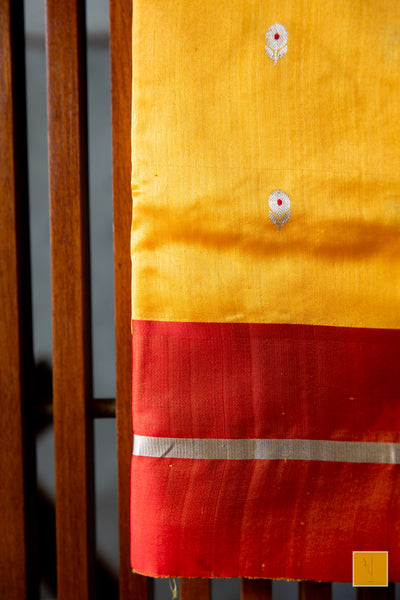 Bumblebee yellow handwoven chanderi silk saree with meenakari buttas and red mashru border.  This yellow tone Chanderi silk sare will add glamour to your wardrobe. Saree gets a completed look with the eknaliya buttas with red meenakari and red mashru border. The saree is extremely soft and very easy to drape.