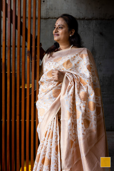 This is a beautiful Off white banarasi cotton handwoven saree. Traditional yet contemporary in it's look. Indian wedding, festivals, handwoven saree for classical music singers, dancers, architects, saree connoisseurs, saree collectors, brides, bridesmaids.