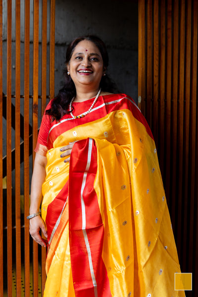 Bumblebee yellow handwoven chanderi silk saree with meenakari buttas and red mashru border.  This yellow tone Chanderi silk sare will add glamour to your wardrobe. Saree gets a completed look with the eknaliya buttas with red meenakari and red mashru border. The saree is extremely soft and very easy to drape.