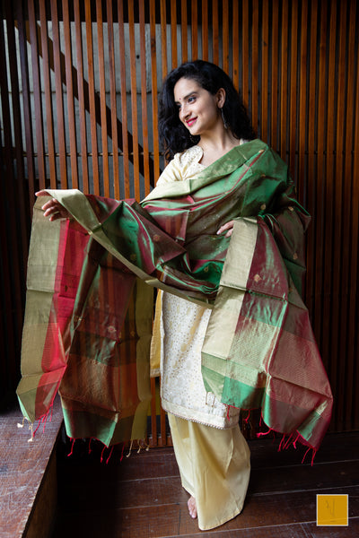 Green and and dual tone handwoven chanderi silk dupatta with buttas.  This dual tone Chanderi silk dupatta is an elegant one for your dupatta collection. A dupatta which can go well for both formal and informal gatherings. Needless to say that, it is soft and easy to drape.