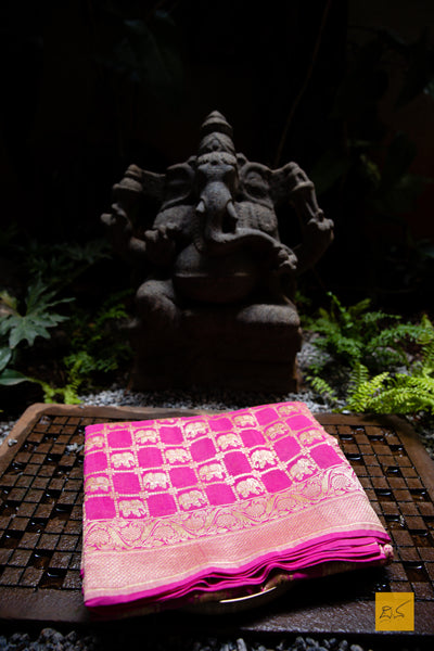 A soothing pink banarasi saree in georgette. perfect for a wedding and festivities too. what say? Presenting a georgette banarasi saree in chequered jaal pattern with woven elephant motifs.