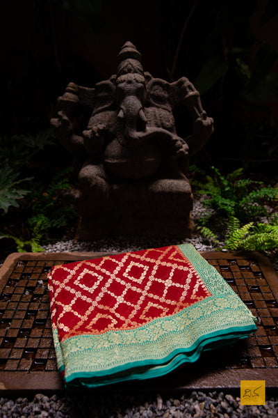 Invoke your inner beauty with this saree! Presenting this lovely red and green contrast georgette banarasi saree with zari jaal pattern. This saree is perfect for wedding receptions, house warming, mehendi, sangeeth and all other festivities.