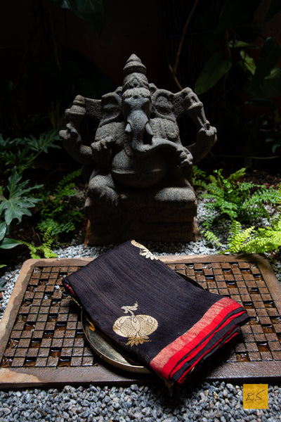You are the MODEST!  Presenting this banarasi matka silk handwoven saree in dark brown and red. The saree has woven kadhwa buttas and the blouse is in red colour.