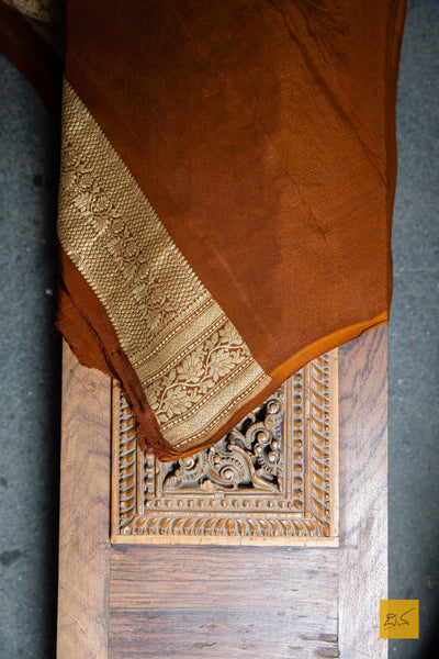 WE are a part of NATURE! A perfect banarasi georgette saree in shades of green and brown, for this wedding and festive season. This sari with zari jaal goes well with a gajra.