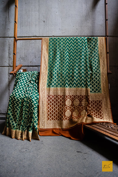 WE are a part of NATURE! A perfect banarasi georgette saree in shades of green and brown, for this wedding and festive season. This sari with zari jaal goes well with a gajra.