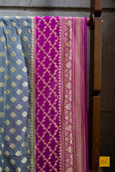 She is the successful one!  Presenting this lovely banarasi georgette saree in the shades of grey and pink. The sari has small buttas woven in cutwork style making it apt for this upcoming wedding and festive season. We would suggest minimal accessories. What will be your choice of accessories for this saree?