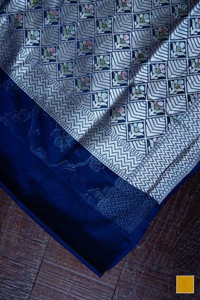 You are the admirer! Presenting this handpainted banarasi saree in shade of dark blue. Perfect for both formal and informal occasions.