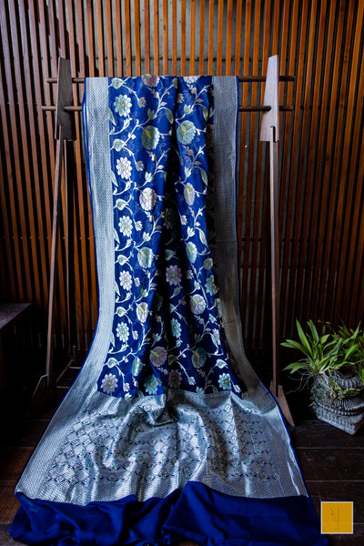 You are the admirer! Presenting this handpainted banarasi saree in shade of dark blue. Perfect for both formal and informal occasions.