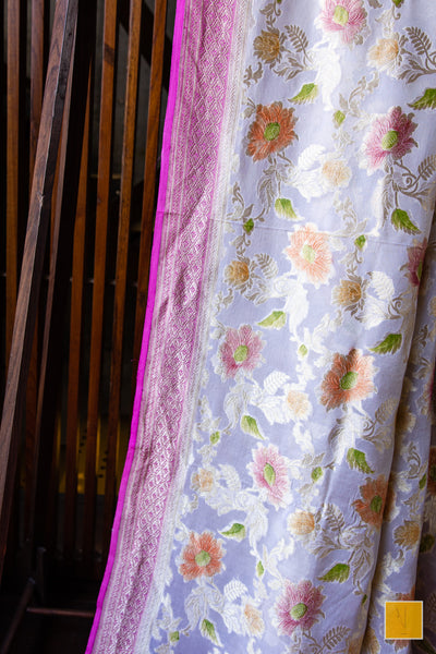 You are the shining one! Presenting this banarasi georgette saree in a pastel pink tone. The saree has hand painted jaal and suits both formal and informal occasions.