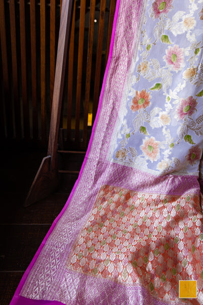 You are the shining one! Presenting this banarasi georgette saree in a pastel pink tone. The saree has hand painted jaal and suits both formal and informal occasions.