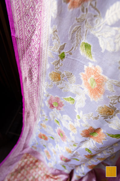 You are the shining one! Presenting this banarasi georgette saree in a pastel pink tone. The saree has hand painted jaal and suits both formal and informal occasions.