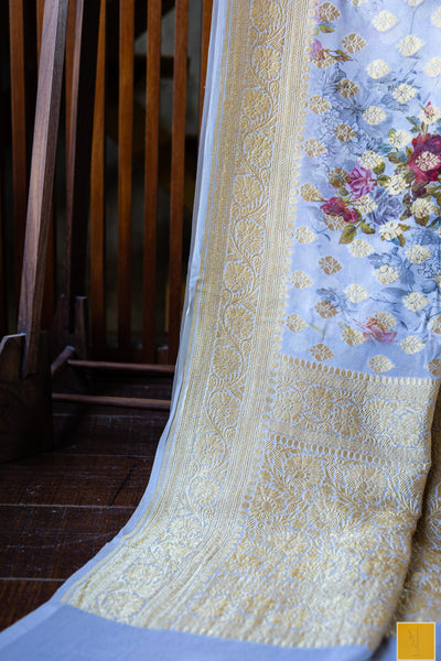 You are the torch bearer of our CULTURE! Presenting this banarasi georgette saree in grey tone. The saree has woven buttas and prints to giving a sophiticated look. Suits both formal and informal occassion.