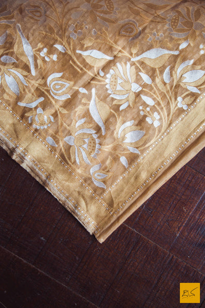 A lovely sheer brown banarasi pure kora silk sarees with small white buttas woven in classic banarasi cutwork style. The border and pallu has woven floral designs in Sona and Rupa zari makes this sari special. New trend of Banarasi Saree designs, Banarasi Saree for artists, art lovers, architects, saree lovers, Saree connoisseurs, musicians, dancers, doctors, Banarasi silk saree, indian saree images, latest sarees with price, only saree images, new Banarasi saree design.