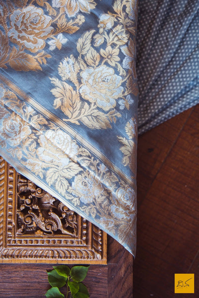 A lovely grey banarasi kora silk saree with small white buttas and exclusive sona and rupa border with rose buttas and pallu. New trend of Banarasi Saree designs, Banarasi Saree for artists, art lovers, architects, saree lovers, Saree connoisseurs, musicians, dancers, doctors, Banarasi silk saree, indian saree images, latest sarees with price, only saree images, new Banarasi saree design.