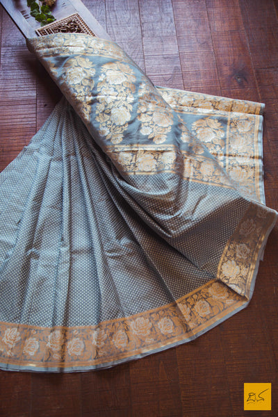A lovely grey banarasi kora silk saree with small white buttas and exclusive sona and rupa border with rose buttas and pallu. New trend of Banarasi Saree designs, Banarasi Saree for artists, art lovers, architects, saree lovers, Saree connoisseurs, musicians, dancers, doctors, Banarasi silk saree, indian saree images, latest sarees with price, only saree images, new Banarasi saree design.