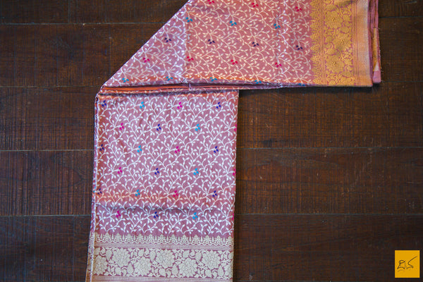 This is a gorgeous Banarasi Handwoven Silk Saree withmeena patola all over the body. The saree has a golden phulkari border. The meena work is so exquisite that it makes the saree adorable. The blouse is of rose pink colour with border. New trend of Banarasi Saree designs, Banarasi Saree for artists, art lovers, architects, saree lovers, Saree connoisseurs, musicians, dancers, doctors, Banarasi silk saree, indian saree images, latest sarees with price, only saree images, new Banarasi saree design.