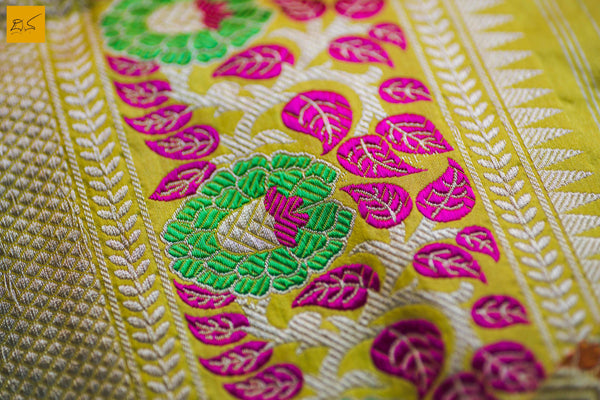 This is a gorgeous Banarasi Silk Saree with meenakari phulari border and pallu. The phulari border is so exquisite that it makes the saree stand out. The saree has small star meena buttas. The blouse is yellow in colour with the border. New trend of Banarasi Saree designs, Banarasi Saree for artists, art lovers, architects, saree lovers, Saree connoisseurs, musicians, dancers, doctors, Banarasi silk saree, indian saree images, latest sarees with price, only saree images, new Banarasi saree design.