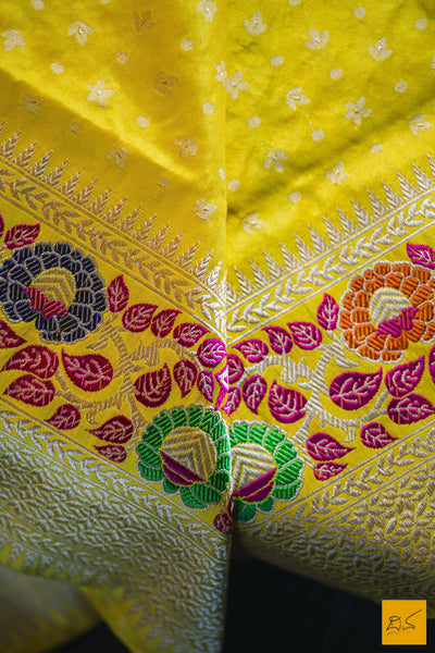This is a gorgeous Banarasi Silk Saree with meenakari phulari border and pallu. The phulari border is so exquisite that it makes the saree stand out. The saree has small star meena buttas. The blouse is yellow in colour with the border. New trend of Banarasi Saree designs, Banarasi Saree for artists, art lovers, architects, saree lovers, Saree connoisseurs, musicians, dancers, doctors, Banarasi silk saree, indian saree images, latest sarees with price, only saree images, new Banarasi saree design.