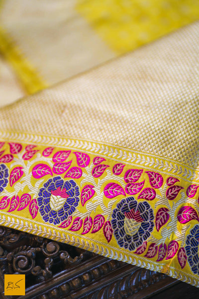 This is a gorgeous Banarasi Silk Saree with meenakari phulari border and pallu. The phulari border is so exquisite that it makes the saree stand out. The saree has small star meena buttas. The blouse is yellow in colour with the border. New trend of Banarasi Saree designs, Banarasi Saree for artists, art lovers, architects, saree lovers, Saree connoisseurs, musicians, dancers, doctors, Banarasi silk saree, indian saree images, latest sarees with price, only saree images, new Banarasi saree design.