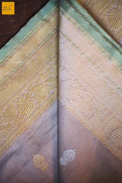 A lovely Banarasi cotton saree with white body and green slevedge. The body has golden silver buttas woven in it. The blouse is of golden brocade intricately woven. New trend of Banarasi Saree designs, Banarasi Saree for artists, art lovers, architects, saree lovers, Saree connoisseurs, musicians, dancers, doctors, Banarasi Katan silk saree, indian saree images, latest sarees with price, only saree images, new Banarasi saree design.