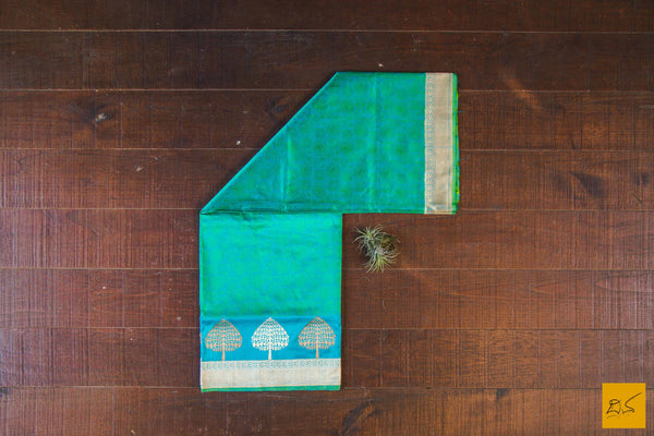 A wonderful banarasi silk tanchoi handwoven sari. The body has blue and green tanchoi work and the blue border has kadhwa motifs woven in antique zari and golden zari alternatively. The blouse has intricately woven zari brocade work with border. New trend of Banarasi Saree designs, Banarasi Saree for artists, art lovers, architects, saree lovers, Saree connoisseurs, musicians, dancers, doctors, Banarasi silk saree, indian saree images, latest sarees with price, only saree images, new Banarasi saree design.