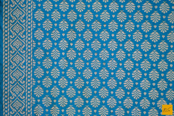 A wonderful banarasi silk tanchoi handwoven sari. The body has blue and green tanchoi work and the blue border has kadhwa motifs woven in antique zari and golden zari alternatively. The blouse has intricately woven zari brocade work with border. New trend of Banarasi Saree designs, Banarasi Saree for artists, art lovers, architects, saree lovers, Saree connoisseurs, musicians, dancers, doctors, Banarasi silk saree, indian saree images, latest sarees with price, only saree images, new Banarasi saree design.