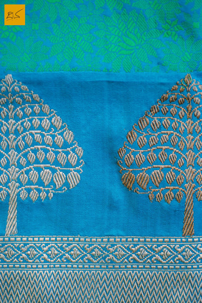 A wonderful banarasi silk tanchoi handwoven sari. The body has blue and green tanchoi work and the blue border has kadhwa motifs woven in antique zari and golden zari alternatively. The blouse has intricately woven zari brocade work with border. New trend of Banarasi Saree designs, Banarasi Saree for artists, art lovers, architects, saree lovers, Saree connoisseurs, musicians, dancers, doctors, Banarasi silk saree, indian saree images, latest sarees with price, only saree images, new Banarasi saree design.