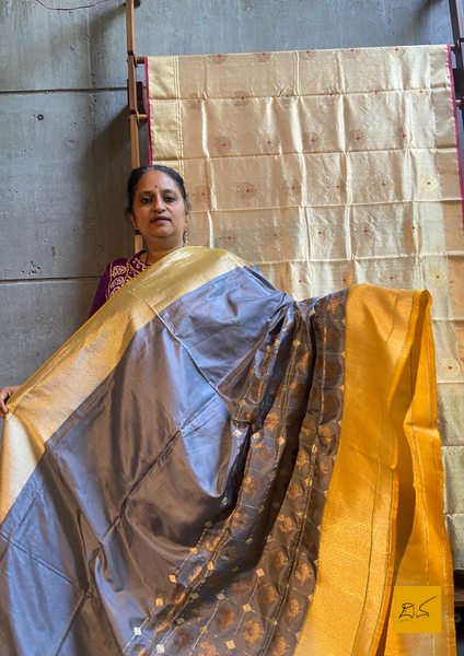 "I love really simple colours - lots of cream, beige, and grey. "  Does it sound familiar? Then this is your pick.  Presenting this banarasi katan silk handwoven saree in a unique combination of Grey and Yellow. This saree has a skirt border and the motifs are woven in kadhwa style. This saree is gorgeous as it is a kadhiyal too. Meaning the body colour and the border colours are different and it makes the saree to stand out and make it special. Needless to say, very soft and easy to drape.