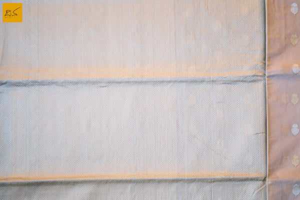 A lovely Banarasi cotton saree with white body and green slevedge. The body has golden silver buttas woven in it. The blouse is of golden brocade intricately woven. New trend of Banarasi Saree designs, Banarasi Saree for artists, art lovers, architects, saree lovers, Saree connoisseurs, musicians, dancers, doctors, Banarasi Katan silk saree, indian saree images, latest sarees with price, only saree images, new Banarasi saree design.