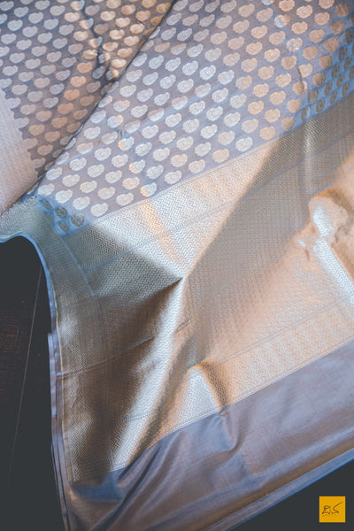 This wonderful Banarasi Katan Silk Saree has it's body covered in Gray colour. New trend of Banarasi Saree designs, Banarasi Saree for artists, art lovers, architects, saree lovers, Saree connoisseurs, musicians, dancers, doctors, Banarasi silk saree, indian saree images, latest sarees with price, only saree images, new Banarasi saree design.