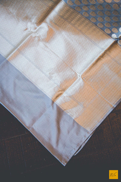 This wonderful Banarasi Katan Silk Saree has it's body covered in Gray colour. New trend of Banarasi Saree designs, Banarasi Saree for artists, art lovers, architects, saree lovers, Saree connoisseurs, musicians, dancers, doctors, Banarasi silk saree, indian saree images, latest sarees with price, only saree images, new Banarasi saree design.