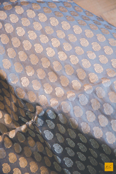 This wonderful Banarasi Katan Silk Saree has it's body covered in Gray colour. New trend of Banarasi Saree designs, Banarasi Saree for artists, art lovers, architects, saree lovers, Saree connoisseurs, musicians, dancers, doctors, Banarasi silk saree, indian saree images, latest sarees with price, only saree images, new Banarasi saree design.