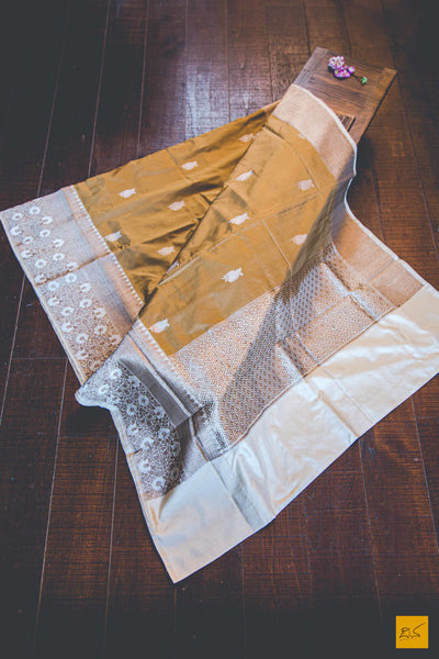 A beautiful katan silk banarasi handwoven sari with a brown body. New trend of Banarasi Saree designs, Banarasi Saree for artists, art lovers, architects, saree lovers, Saree connoisseurs, musicians, dancers, doctors, Banarasi Katan silk saree, indian saree images, latest sarees with price, only saree images, new Banarasi saree design.