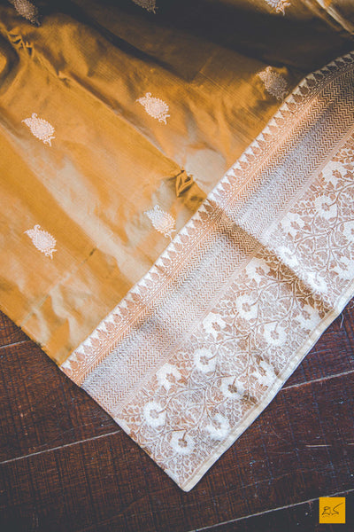 A beautiful katan silk banarasi handwoven sari with a brown body. New trend of Banarasi Saree designs, Banarasi Saree for artists, art lovers, architects, saree lovers, Saree connoisseurs, musicians, dancers, doctors, Banarasi Katan silk saree, indian saree images, latest sarees with price, only saree images, new Banarasi saree design.