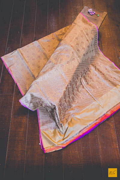 A beautiful banarasi katan silk handwoven sari with all over jaal with buttas. TheBeige Brown body gives a soothing definition to the saree. New trend of Banarasi Saree designs, Banarasi Saree for artists, art lovers, architects, saree lovers, Saree connoisseurs, musicians, dancers, doctors, Banarasi katan silk saree, indian saree images, latest sarees with price, only saree images, new Banarasi saree design.