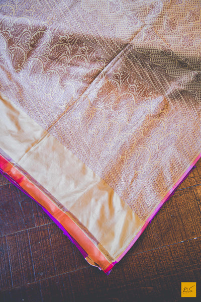 A beautiful banarasi katan silk handwoven sari with all over jaal with buttas. TheBeige Brown body gives a soothing definition to the saree. New trend of Banarasi Saree designs, Banarasi Saree for artists, art lovers, architects, saree lovers, Saree connoisseurs, musicians, dancers, doctors, Banarasi katan silk saree, indian saree images, latest sarees with price, only saree images, new Banarasi saree design.