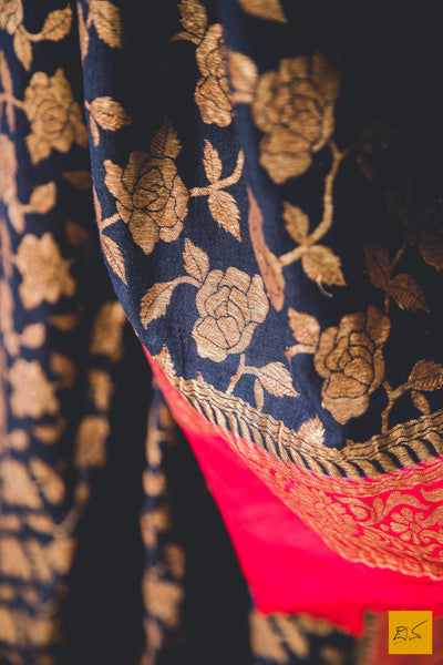 A classy combination of black and red coming together in this black and red banarasi munga silk dupatta, statement piece