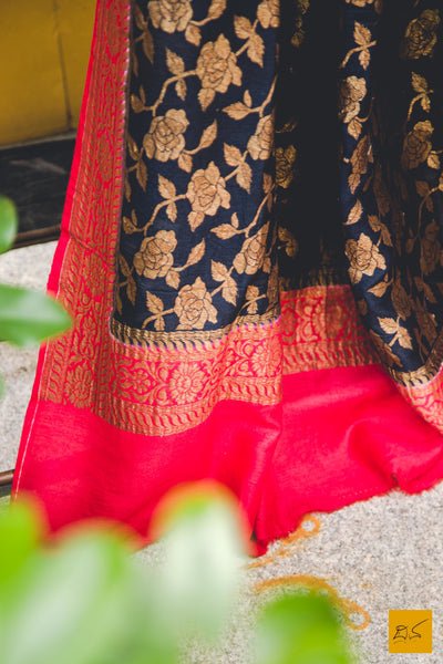A classy combination of black and red coming together in this black and red banarasi munga silk dupatta, statement piece