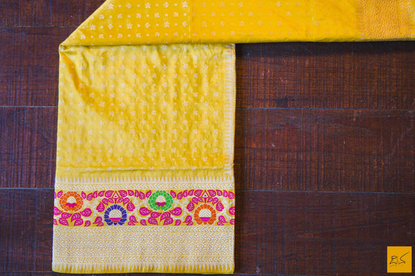 This is a gorgeous Banarasi Silk Saree with meenakari phulari border and pallu. The phulari border is so exquisite that it makes the saree stand out. The saree has small star meena buttas. The blouse is yellow in colour with the border. New trend of Banarasi Saree designs, Banarasi Saree for artists, art lovers, architects, saree lovers, Saree connoisseurs, musicians, dancers, doctors, Banarasi silk saree, indian saree images, latest sarees with price, only saree images, new Banarasi saree design.