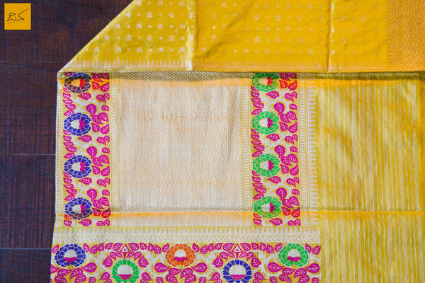 This is a gorgeous Banarasi Silk Saree with meenakari phulari border and pallu. The phulari border is so exquisite that it makes the saree stand out. The saree has small star meena buttas. The blouse is yellow in colour with the border. New trend of Banarasi Saree designs, Banarasi Saree for artists, art lovers, architects, saree lovers, Saree connoisseurs, musicians, dancers, doctors, Banarasi silk saree, indian saree images, latest sarees with price, only saree images, new Banarasi saree design.