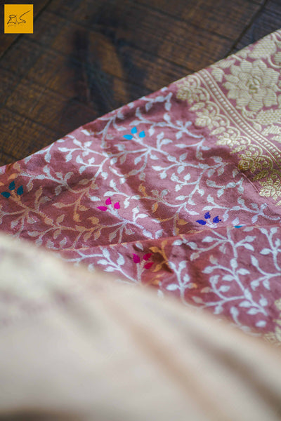 This is a gorgeous Banarasi Handwoven Silk Saree withmeena patola all over the body. The saree has a golden phulkari border. The meena work is so exquisite that it makes the saree adorable. The blouse is of rose pink colour with border. New trend of Banarasi Saree designs, Banarasi Saree for artists, art lovers, architects, saree lovers, Saree connoisseurs, musicians, dancers, doctors, Banarasi silk saree, indian saree images, latest sarees with price, only saree images, new Banarasi saree design.