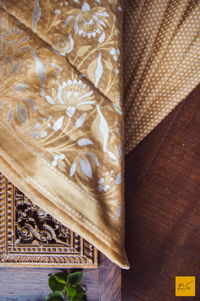 A lovely sheer brown banarasi pure kora silk sarees with small white buttas woven in classic banarasi cutwork style. The border and pallu has woven floral designs in Sona and Rupa zari makes this sari special. New trend of Banarasi Saree designs, Banarasi Saree for artists, art lovers, architects, saree lovers, Saree connoisseurs, musicians, dancers, doctors, Banarasi silk saree, indian saree images, latest sarees with price, only saree images, new Banarasi saree design.