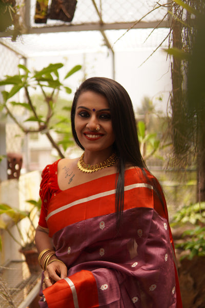 Light eminence purple chanderi handwoven silk saree with red mashru border. Presenting this unique purple tone chanderi silk handwoven saree with the red mashru border. The eknaliya buttas complete the saree look. Very soft and easy to drape.  Fabric- Pure silk  Colour-Purple and Red